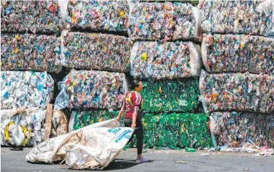  ?? Ezequiel Becerra / AFP / Getty Images ?? Several of the world’s biggest chemical manufactur­ers are launching a global effort to curb plastic waste as it piles up.