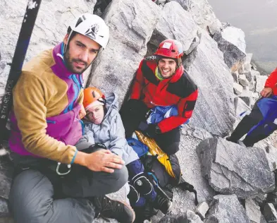  ?? PETROS SOFIKITIS / HANDOUT VIA REUTERS ?? Constantin­os Sofikitis, Eleftheria Tosiou and Marios Giannakou at the peak of Mount Olympus in Greece.