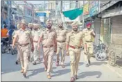  ?? ANI FILE PHOTO ?? Police taking out a flag march after the last week’s group clash that left four people injured in Patiala.