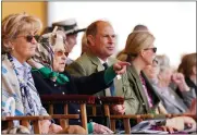  ?? STEVE PARSONS — PA VIA AP ?? Britain’s Queen Elizabeth II is joined by Prince Edward and Sophie, right, the Earl and Countess of Wessex as they sit in the Royal Box at the Royal Windsor Horse Show, Windsor, England, on Friday.