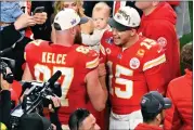  ?? DAVID BECKER — THE ASSOCIATED PRESS ?? Kansas City Chiefs quarterbac­k Patrick Mahomes, right, and tight end Travis Kelce, left, celebrate their win against the San Francisco 49ers in overtime in Super Bowl 58.