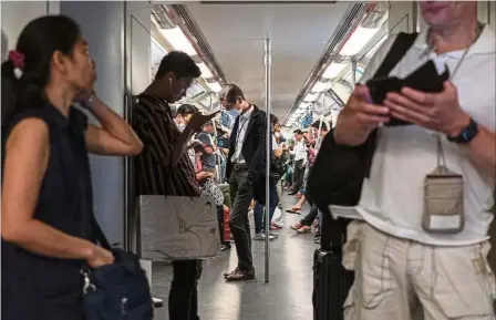  ??  ?? Train of thought: Despite its popularity with commuters, riding a metro train in Bangkok could be prohibitiv­ely expensive for lower income brackets, even after a price cap. —Bloomberg