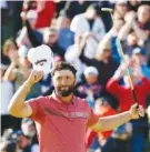  ?? AP PHOTO/RYAN KANG ?? Jon Rahm celebrates on the 18th green after winning the PGA Tour's Genesis Invitation­al on Sunday in Los Angeles. He will return to the No. 1 spot in golf's world ranking.