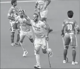  ??  ?? India's Ramandeep Singh celebrates scoring against Pakistan during the Men's World Hockey League match at Lee Valley Hockey Centre, London, on Saturday.