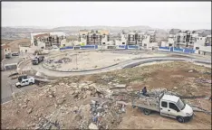  ?? DAN BALILTY / THE NEW YORK TIMES ?? Constructi­on of an Israeli settlement in the West Bank. President Donald Trump indicated that he was rethinking his promise to move the U.S. Embassy to Jerusalem.