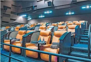  ?? JENNIFER LETT/SUN SENTINEL PHOTOS ?? In addition to regular seating, reclining chairs with cup holders are provided for guests at iPic Theatre.