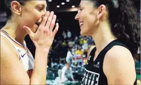  ?? Elaine Thompson / Associated Press ?? The Mercury’s Diana Taurasi, left, talks with the Storm’s Sue Bird after the Mercury defeated the Storm in the second round of the WNBA playoffs Sunday in Everett, Wash.