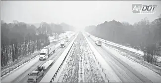  ?? Arkansas Department of Transporta­tion ?? Interstate 40 traffic was crawling along this morning during inclement weather. Law enforcemen­t officers and first responders were called to several reports of wrecks and vehicles that had become disabled throughout the day due to the icy weather.