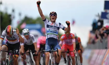  ??  ?? Damiano Cima crosses the line to complete victory in the 18th stage. Photograph: Tim de Waele/Getty Images