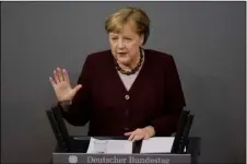  ?? AP PHOTO/MARKUS SCHREIBER ?? German Chancellor Angela Merkel delivers a speech about German government’s policies to combat the spread of the coronaviru­s and COVID-19 disease at the parliament Bundestag, in Berlin, Germany, Thursday.