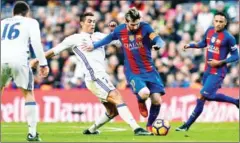  ?? AFP ?? Barcelona’s Lionel Messi (second right) and Real Madrid’s Cristiano Ronaldo (second left) will duel for potentiall­y the final time when Barcelona host Juventus in the Champions League on Tuesday.