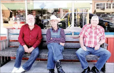  ?? PHOTOS BY LYNN KUTTER ENTERPRISE-LEADER ?? Ralph Hollingsfo­rth, left, Ralph Dotson and Charles Smith enjoyed Trades Day by sitting on a bench and visiting with each other. Dotson brought his 1949 Mercury coupe for people to see.