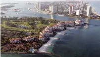  ?? — AFP ?? An aerial view of Fisher Island residentia­l compound (left) with a view of the southern tip of Miami Beach, Florida.