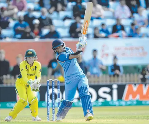  ??  ?? DESTROYER: India’s Harmanpree­t Kaur hits out during the Women’s World Cup semi-final against Australia. Picture: GETTY