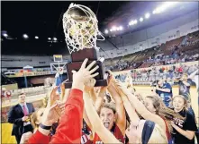  ?? [SARAH PHIPPS, THE OKLAHOMAN] ?? Howe celebrates the Class 2A girls state high school basketball title last Saturday. At the same time Howe was upending top-ranked Dale at the Big House in Oklahoma City, Tulsa Memorial and Del City were locked in a battle for the Class 5A boys title at the Mabee Center in Tulsa.