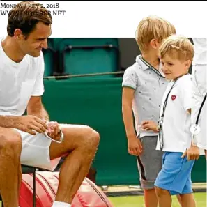  ?? —INSTAGRAM ?? Roger Federer attends to four-year-old twin sons Leo and Lenny during a break in practice at Wimbledon.
