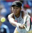  ?? KAREEM ELGAZZAR/THE CINCINNATI ENQUIRER VIA AP ?? Naomi Osaka returns a shot against Sofia Kenin during a quarterfin­al match of the Western & Southern Open last week in Mason, Ohio.