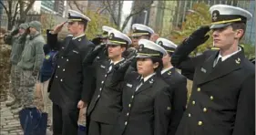  ??  ?? Members of the U.S. Navy Operationa­l Support Center salute during the opening ceremonies of the Veterans Day parade.