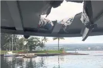  ?? THE ASSOCIATED PRESS ?? The roof of a tour boat after an explosion sent lava flying through the roof off the Big Island of Hawaii on Monday.