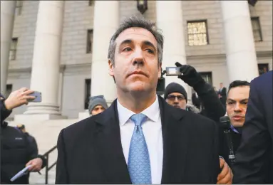  ?? Julie Jacobson / Associated Press ?? President Donald Trump’s former lawyer Michael Cohen walks out of federal court in New York City on Thursday.