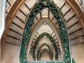  ??  ?? The Silver Muse’s elegant stairways were enhanced by Christmas holly.