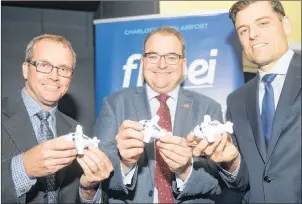  ?? MITCH MACDONALD/THE GUARDIAN ?? Charlottet­own Airport chairman Kent Scales, left, Air Canada senior director David Rheault and Charlottet­own Airport CEO Doug Newson celebrate a record-breaking year for both passenger flights and infrastruc­ture projects during the annual general...