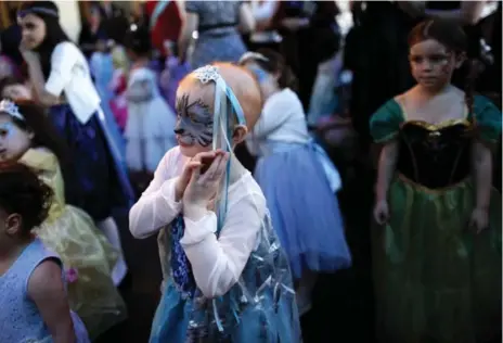  ?? MARTA IWANEK PHOTOS/TORONTO STAR ?? Marlow Ploughman, 5, dances at the Princess Ball at the Liberty Grand. Marlow is being treated for a rare and aggressive form of cancer.