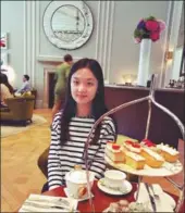  ?? PROVIDED TO CHINA DAILY ?? Chen Yixin samples British afternoon tea after class. She attended a summer school camp in the UK in 2016.