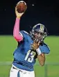  ??  ?? Heritage Hall quarterbac­k Robert Mbroh throws the ball during Thursday night’s high school game against Perkins-Tryon in Oklahoma City.