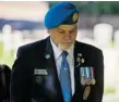  ?? ANDREW CABALLERO-REYNOLDS ?? Newfoundla­nd peacekeepi­ng veteran Garry Best at the grave of Cpl. Otto Redmond in Cyprus.