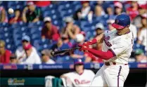  ?? MITCHELL LEFF / GETTY IMAGES ?? Asdrubal Cabrera turns a Drew Steckenrid­er slider into a game-winning homer Sunday against the visiting Marlins.