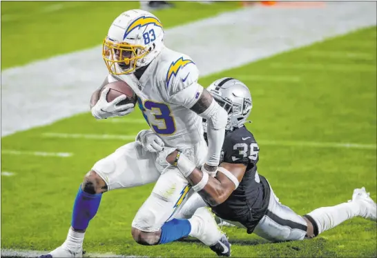  ?? Heidi Fang Las Vegas Review-journal @Heidi Fang ?? Raiders cornerback Daryl Worley can’t prevent a 26-yard touchdown catch by Chargers wide receiver Tyron Johnson in the second quarter of Los Angeles’ victory Thursday.