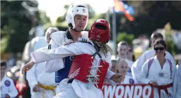  ??  ?? Left: Ivana and Ivica Braha of Braha’s Martial Arts spar for the crowd during last year’s parade.