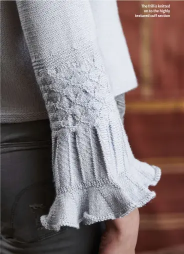  ??  ?? The frill is knitted on to the highly textured cuff section