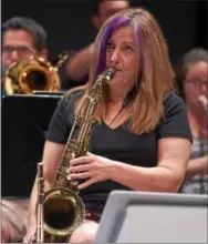  ??  ?? West Chester University jazz ensemble alumna Dawn Krown rehearses Wednesday morning. Krown is a music teacher and department chair at Perkiomen Valley School District.