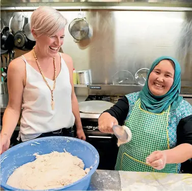  ?? DOMINICO ZAPATA/STUFF ?? Tania Jones, founder of Home Kitchen and Taj Begum, an Afghani refugee, is getting involved cooking traditiona­l Afghani food.