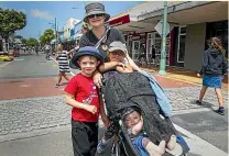  ?? LIAM COURTENAY/ STUFF ?? It was the best parade ever according to Fiona Ritson with her sons, 5-year-old Lewis and Campbell, 6 months, as well as friend Vida Symes, 5.