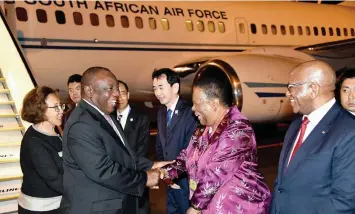  ?? GCIS ?? PRESIDENT Cyril Ramaphosa and First Lady Dr Tshepo Motsepe are welcomed by Minister of Internatio­nal Relations and Co-operation Dr Naledi Pandor and Ambassador Smuts Ngonyama on arrival at Kansai Internatio­nal Airport in Osaka, Japan, ahead of the annual G20 Summit which takes place from today until tomorrow. The summit will focus on eight key themes spanning the global economy, trade and investment, innovation, environmen­t and energy, employment, women’s empowermen­t, developmen­t and health. | ELMOND JIYANE