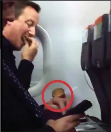  ??  ?? Peckish: David Cameron eats a tube of Pringles, circled