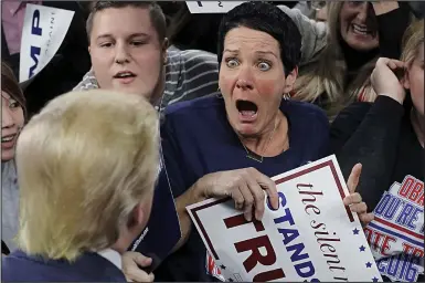  ??  ?? It’s really you! The unidentifi­ed supporter is overcome as she faces Trump – and his hair