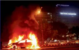  ?? — PTI ?? A car caught fire in front of police headquarte­rs in New Delhi on Tuesday. Two fire tenders were pressed into service to douse the flames. The incident resulted in a traffic congestion on the road connecting ITO to east Delhi.