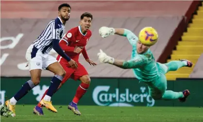  ??  ?? Roberto Firmino’s 89th-minute header, only Liverpool’s second attempt on target, is tipped round the post by West Brom’s Sam Johnstone. Photograph: Clive Brunskill/Reuters