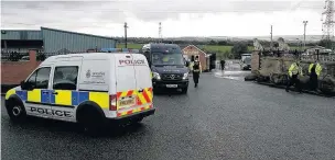  ??  ?? Police enforcing a closure order on the TH Smith site on Meadow Street in Great Harwood.