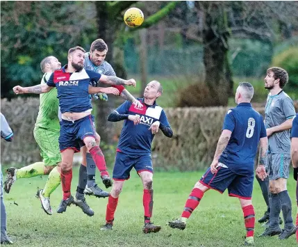  ?? Pictures: Steve Bould ?? HEADS UP: Action from the Cheshire Cheese v Wolstanton Social Club encounter.