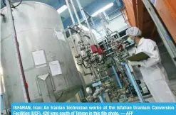  ?? — AFP ?? ISFAHAN, Iran: An Iranian technician works at the Isfahan Uranium Conversion Facilities (UCF), 420 kms south of Tehran in this file photo.