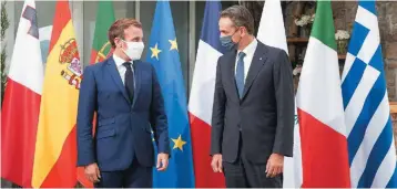  ??  ?? Greece’s Prime Minister Kyriakos Mitsotakis (right) speaks with French President Emmanuel Macron during their meeting on the island of Corsica, on the sidelines of yesterday’s Euro-Mediterran­ean Conference (MED7). The two leaders were reportedly in ‘complete agreement’ with regard to Turkey’s behavior in the Eastern Mediterran­ean.