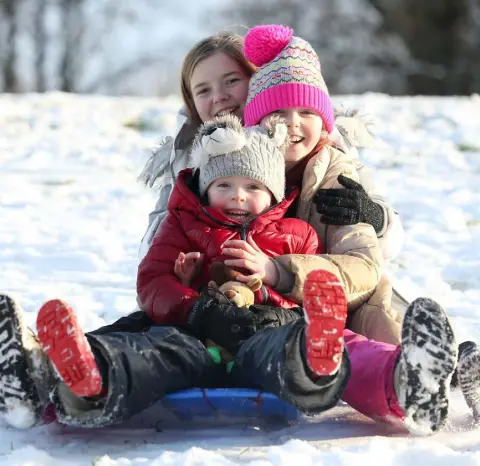  ?? Picture: Matt Mackey/Presseye.com ?? PISTE PROJECT: Jack (5), sister Mia (10) and friend Rachel (11) sledging at Stormont in Belfast.