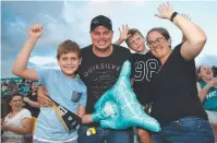  ??  ?? FAMILY: The Andersens, David, Danielle and boys Lachlan, 7, and James, 10, enjoy the game.