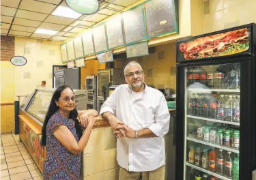 ?? Jim Wilson / New York Times ?? Above: Sadhana and Manoj Tripathi, at one of their Subways, in Orinda, say they lost stores over petty infraction­s. Below: Inspector Rebecca Husler says her supervisor ordered her to find fault with the store.