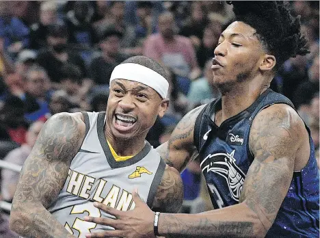  ?? PHELAN M. EBENHACK/THE ASSOCIATED PRESS ?? Point guard Isaiah Thomas, left, is one of several veterans traded from Cleveland before Thursday’s NBA deadline. Thomas is now a Los Angeles Laker, while fellow point guard Elfrid Payton, right, was sent from the Orlando Magic to the Phoenix Suns.